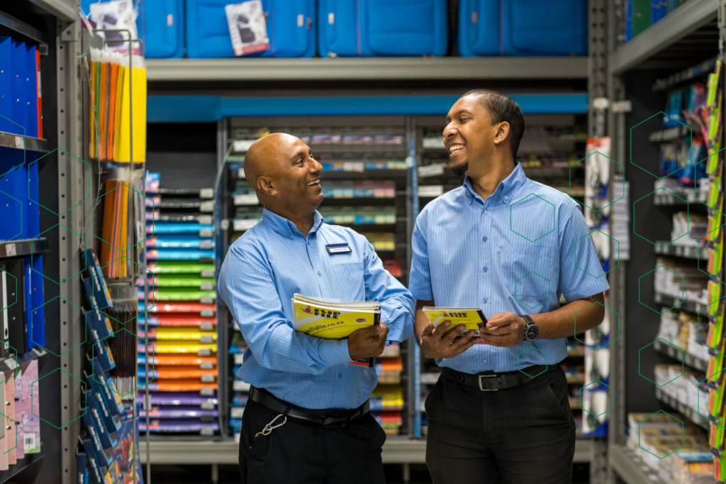 Two Bordax specialists reviewing a promotion in the stationery aisle